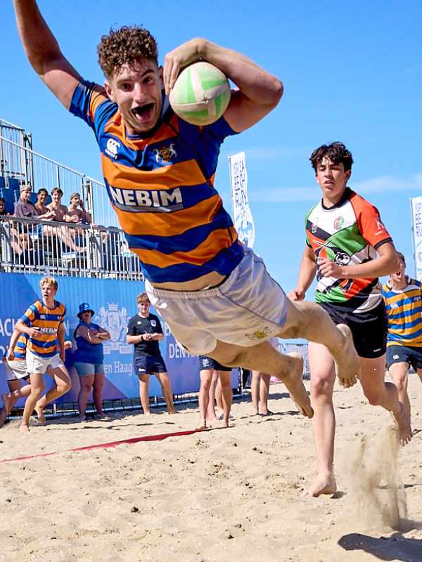 Energetic Beach Rugby Match and try Energetic Beach Rugby Match and try Played on a Sunny Sandy Beach Location