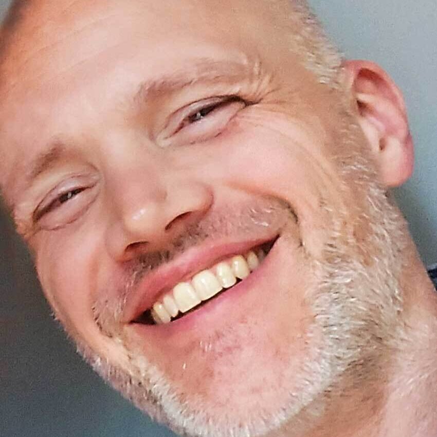 Man smiling at North Sea Beach Rugby Den Haag team